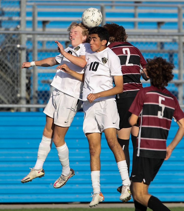 Jordan forward Cole Vernon (9) and midfielder Juancarlos Santos (10) leap to head the ball during the Class 5A boys state semifinal between Dripping Springs and Katy Jordan on April 14, 2022 in Georgetown, Texas.