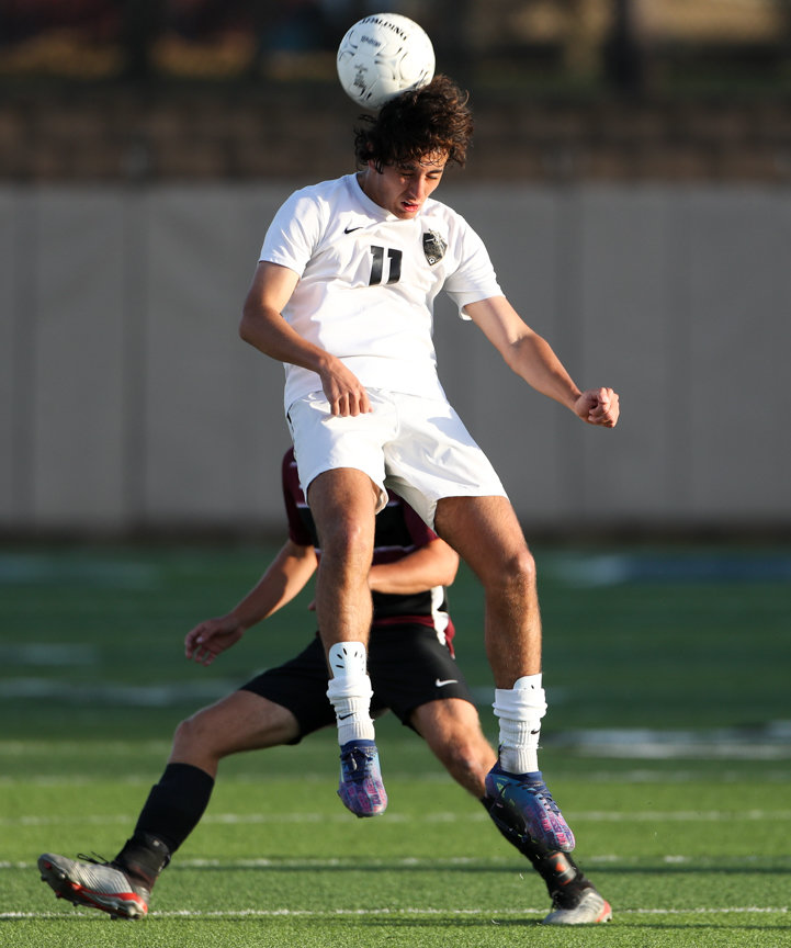 Jordan forward Hani Taan (11) leaps to head the ball during the Class 5A boys state semifinal between Dripping Springs and Katy Jordan on April 14, 2022 in Georgetown, Texas.