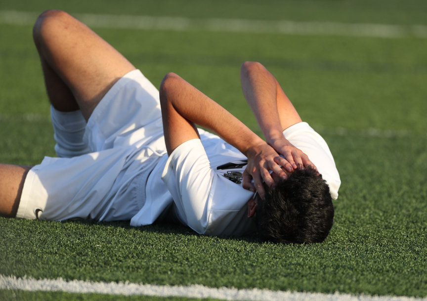 Jordan midfielder Juancarlos Santos (10) takes a moment n the field after a 1-0 loss to Dripping Springs in the Class 5A boys state semifinal on April 14, 2022 in Georgetown, Texas.