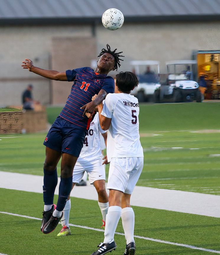 Seven Lakes forward Daniel Ejerenwa (11) heads the ball during the Class 6A boys state semifinal between Katy Seven Lakes and Plano on April 15, 2022 in Georgetown, Texas.