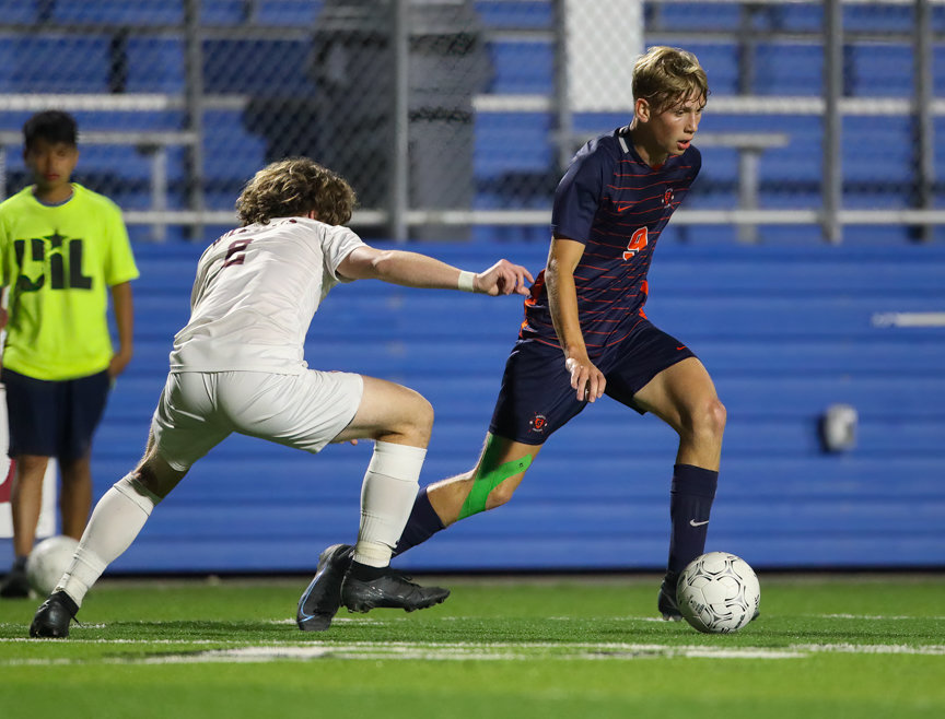 Seven Lakes forward Hunter Merritt (9) sets up a pass during the Class 6A boys state semifinal between Katy Seven Lakes and Plano on April 15, 2022 in Georgetown, Texas.