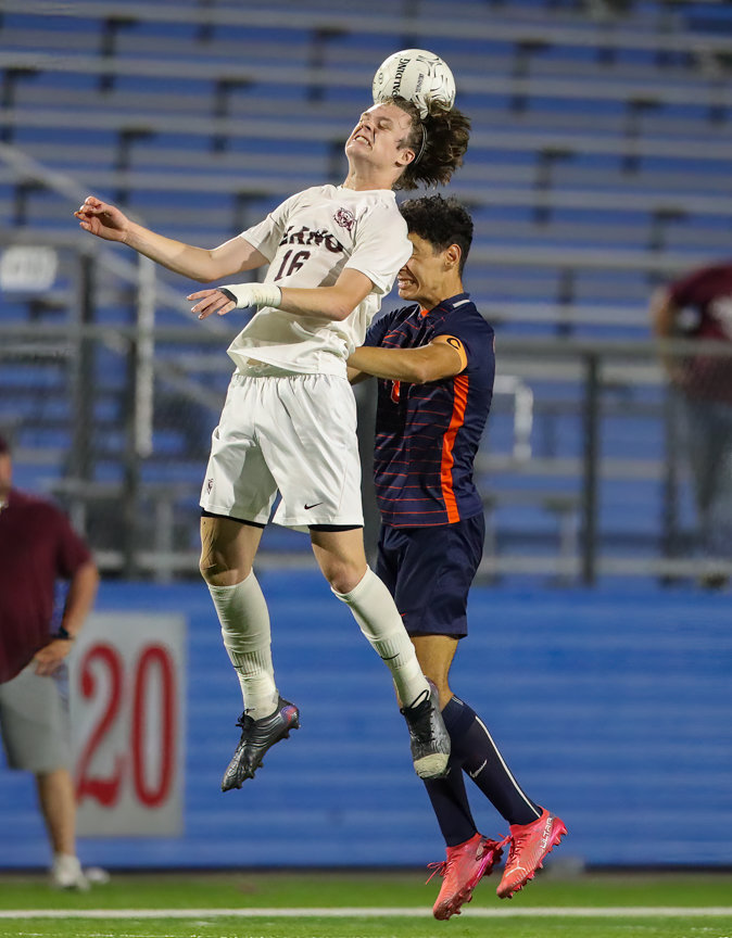 Plano forward Nolan Giles (16) leaps to head the ball during the Class 6A boys state semifinal between Katy Seven Lakes and Plano on April 15, 2022 in Georgetown, Texas.