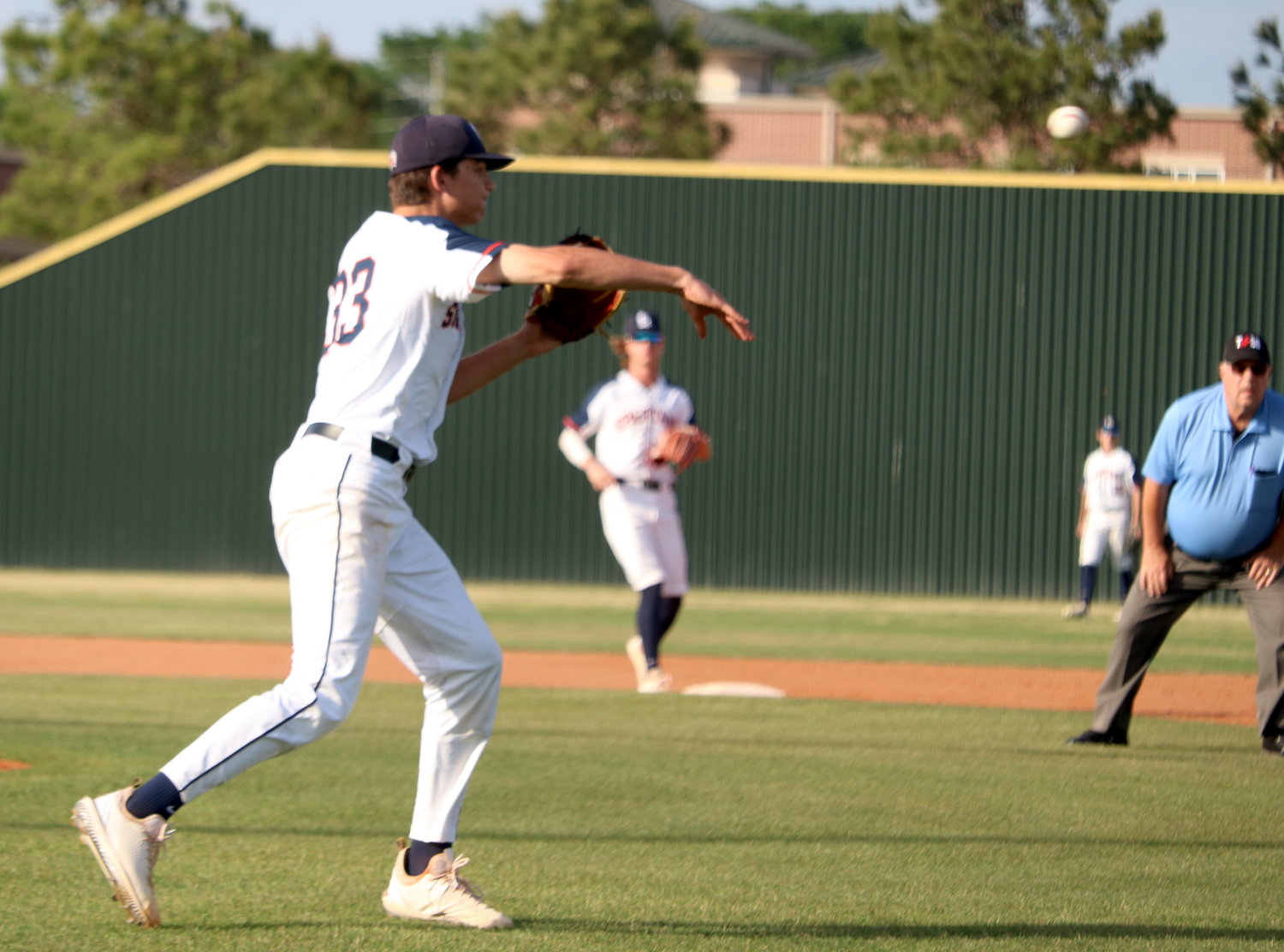 Nathan Johnson makes a throw to first base during Friday’s District 19-6A  game between Seven Lakes and Cinco Ranch at the Seven Lakes baseball field.