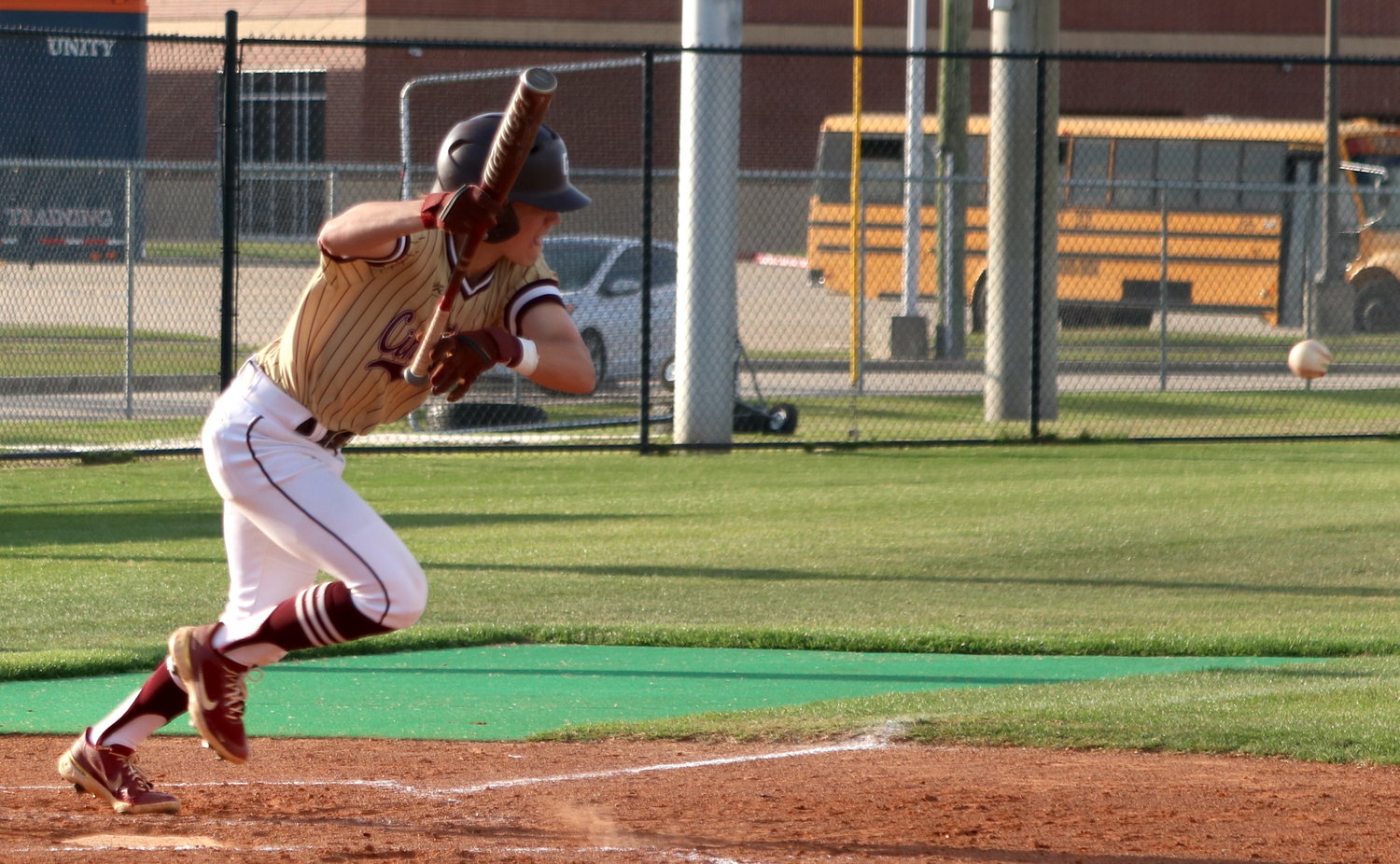 A Cinco Ranch player bunts during Friday’s District 19-6A  game between Seven Lakes and Cinco Ranch at the Seven Lakes baseball field.