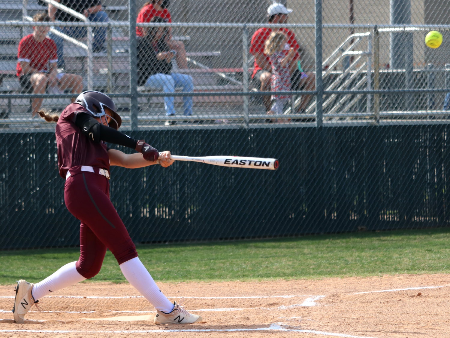 Faith Piper hits during Friday’s bi-district game between Cinco Ranch and Fort Bend Travis.