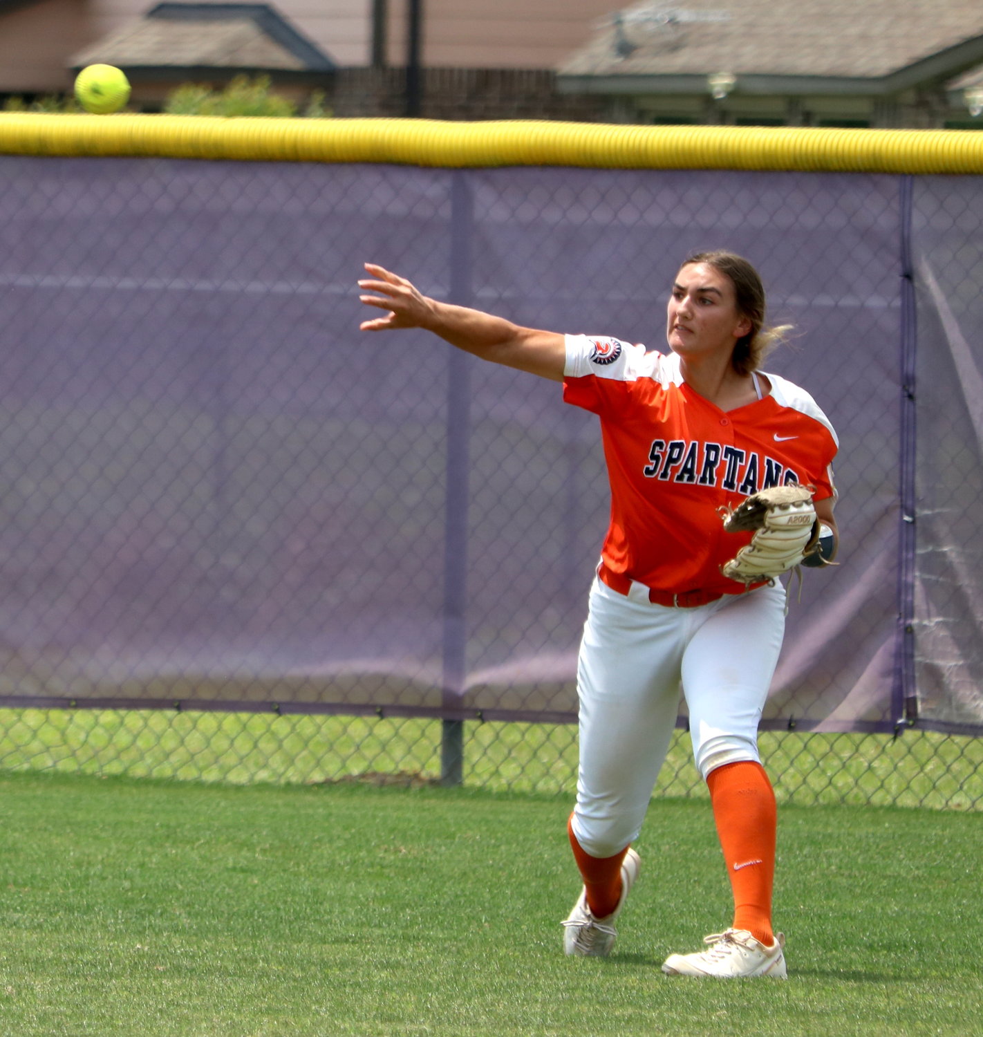 Meghan Kelly throws a ball towards home plate during Saturday’s bi-district round game between Seven Lakes and Ridge Point at the Ridge Point softball field.