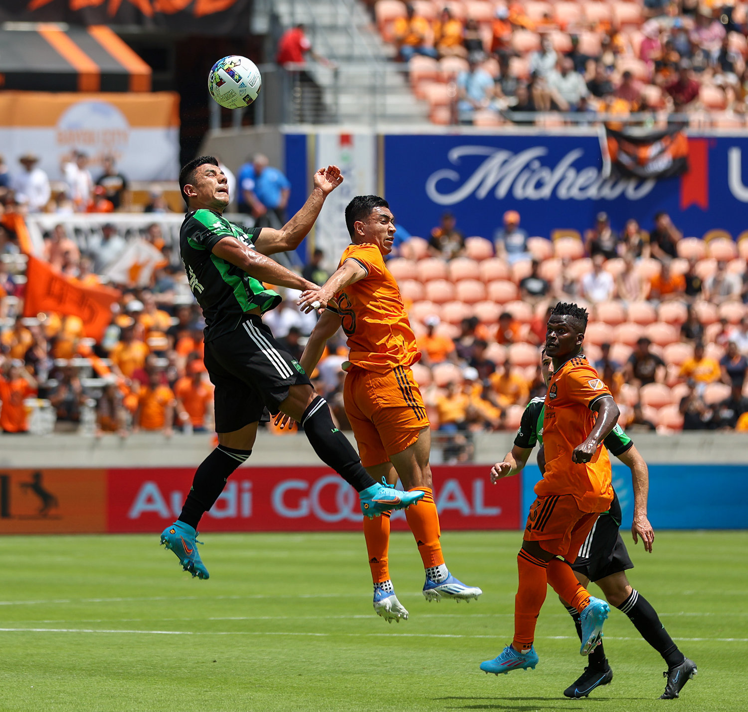 Austin FC defender Nick Lima (24) leaps to head the ball in the first half of a Major League Soccer match between the Houston Dynamo and Austin FC on April 30, 2022 in Houston, Texas.