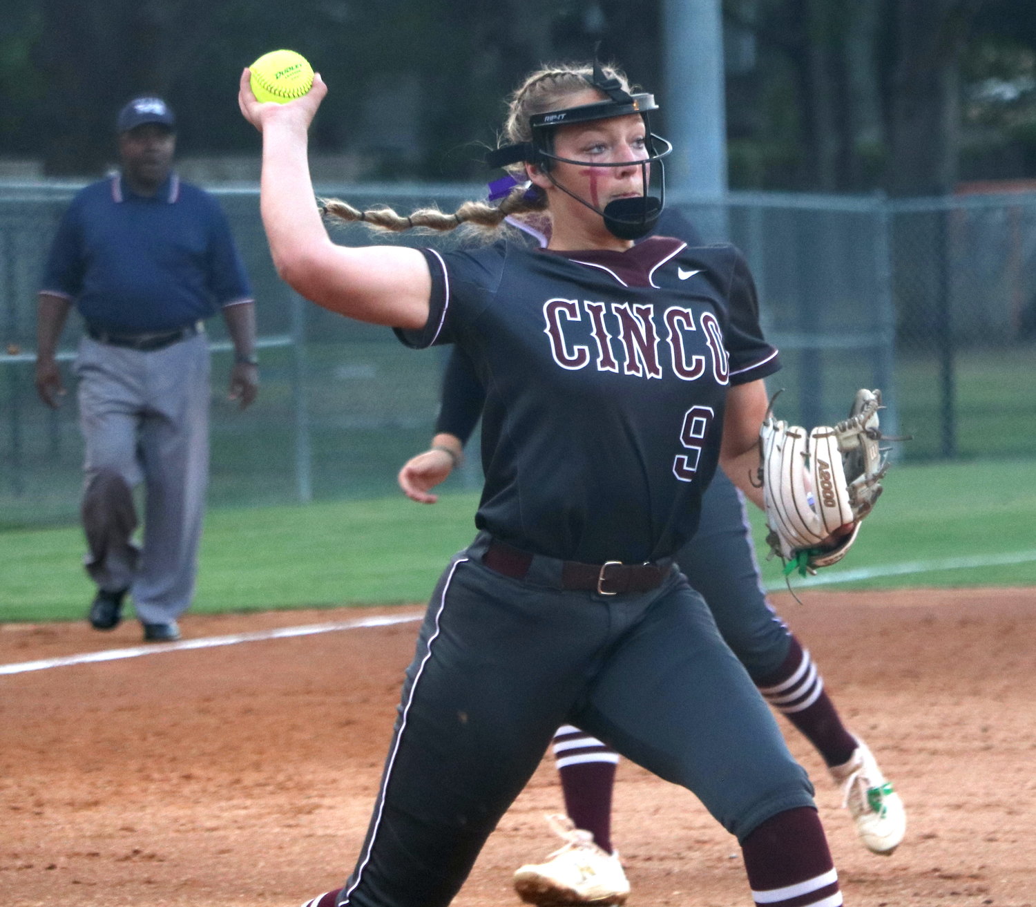 Chela Kovar throws a ball to first base during Friday's area round game between Cinco Ranch and Heights at Memorial High School.