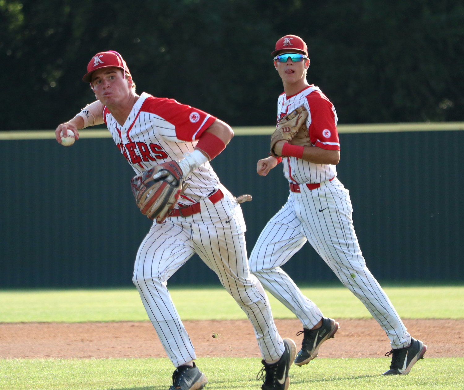 Parker Kidwell throws to first base during Friday’s area round game between Katy and Jersey Village at the Katy baseball field.