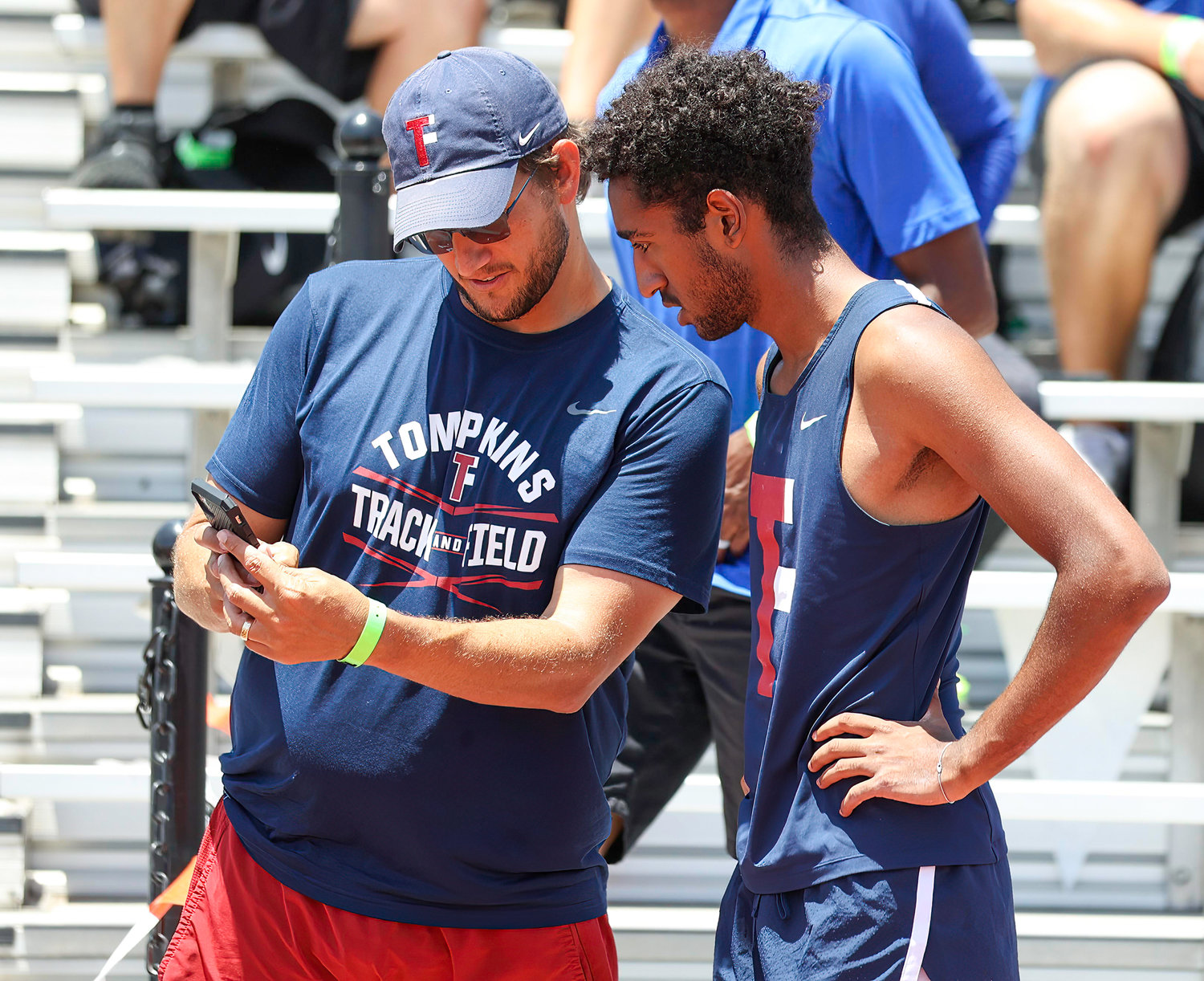 Matthew Kumar of Tompkins High School talks with his coach during the Class 6A boys pole vault event at the UIL State Track and Field Meet on May 14, 2022 in Austin, Texas. Kumar earned a gold medal with a jump of 16 feet, 3 inches.