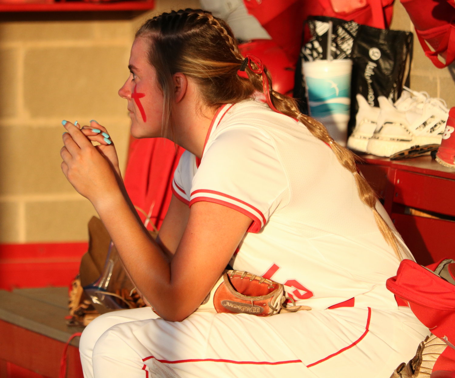 Cameryn Harrison watches Katy bat from the dugout during Wednesday’s Class 6A Regional Semifinal game between Katy and Pearland at the Katy softball field.