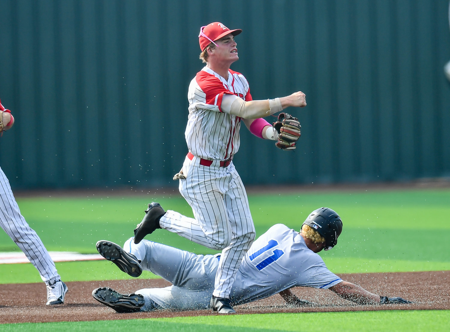Katy's Parker Kidwell (2) makes the play at second for the out and the throw to first during the third inning during a Region III-6A quarterfinals baseball game at Langham Creek High School, Saturday, May 21, 2022.
