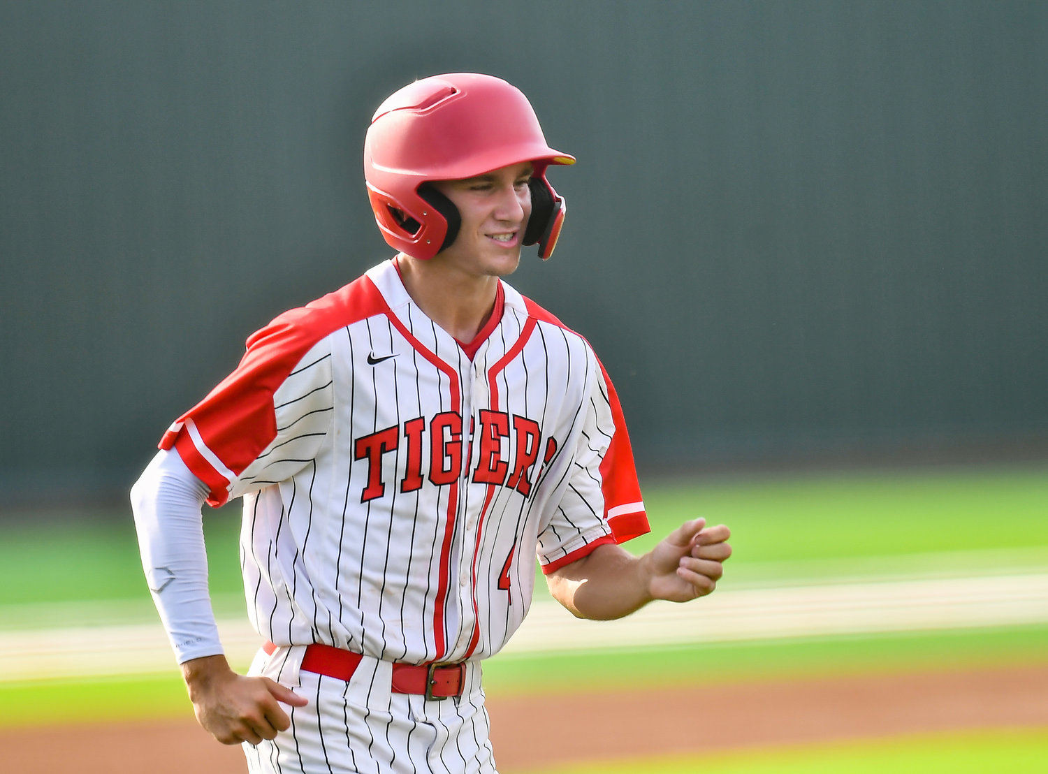 Katy's Andrew Hilton (4) scores on a bases loaded walk during the sixth inning during a Region III-6A quarterfinals baseball game at Langham Creek High School, Saturday, May 21, 2022.