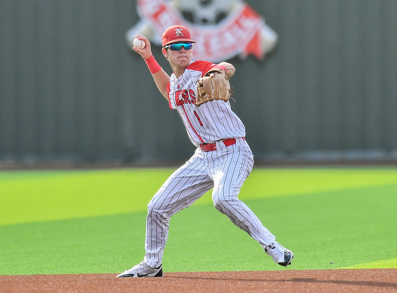Katy's Graham Laxton (1) fields a ball hit to short stop during the seventh inning during a Region III-6A quarterfinals baseball game at Langham Creek High School, Saturday, May 21, 2022.