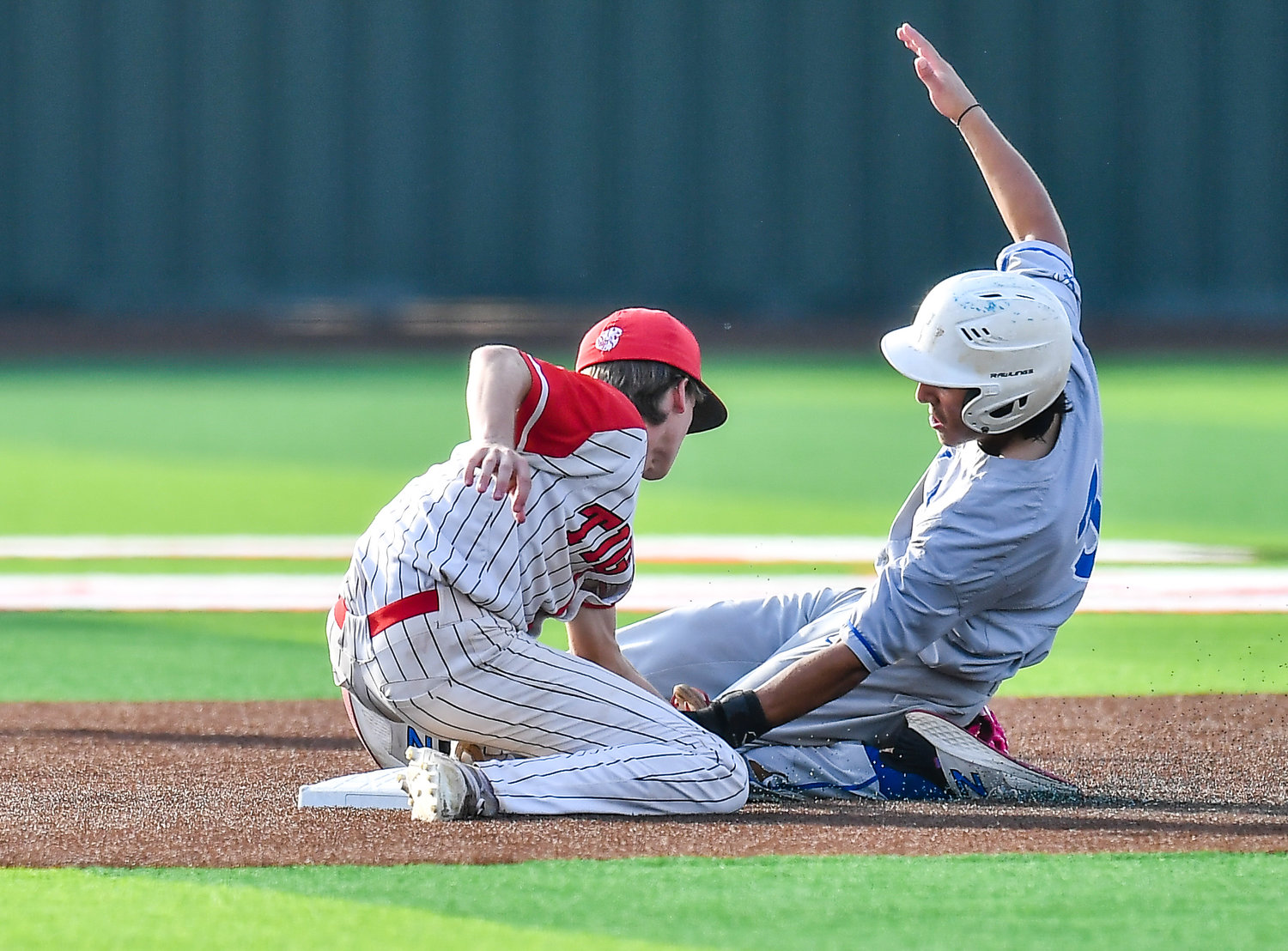 Katy Taylor's Nate Lopez (3) is tagged out by Katy's Josh Dunayczan (6) during the seventh inning during a Region III-6A quarterfinals baseball game at Langham Creek High School, Saturday, May 21, 2022.