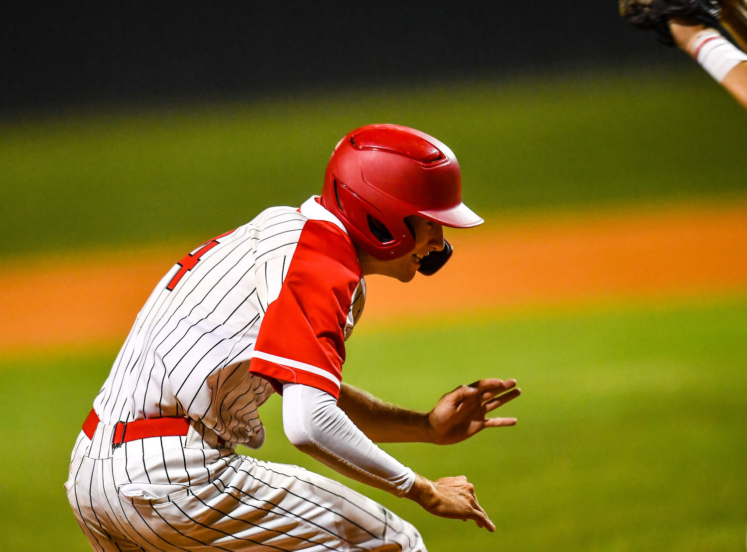 Katy's Andrew Hilton (4) gets under the throw at home scoring the winning run in extra innings during a Region III-6A SemiFinals baseball game between Katy and Strake Jesuit at Mayde Creek High School, Friday, May 27, 2022.