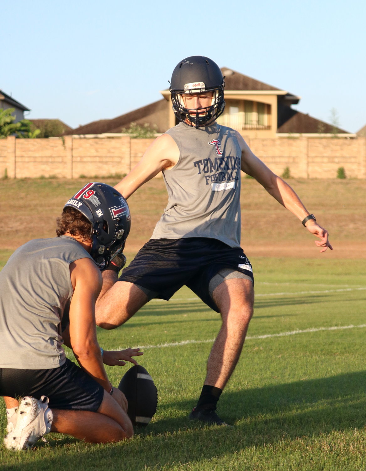 A Tompkins kicker kicks a ball through the uprights during Tuesday’s practice.