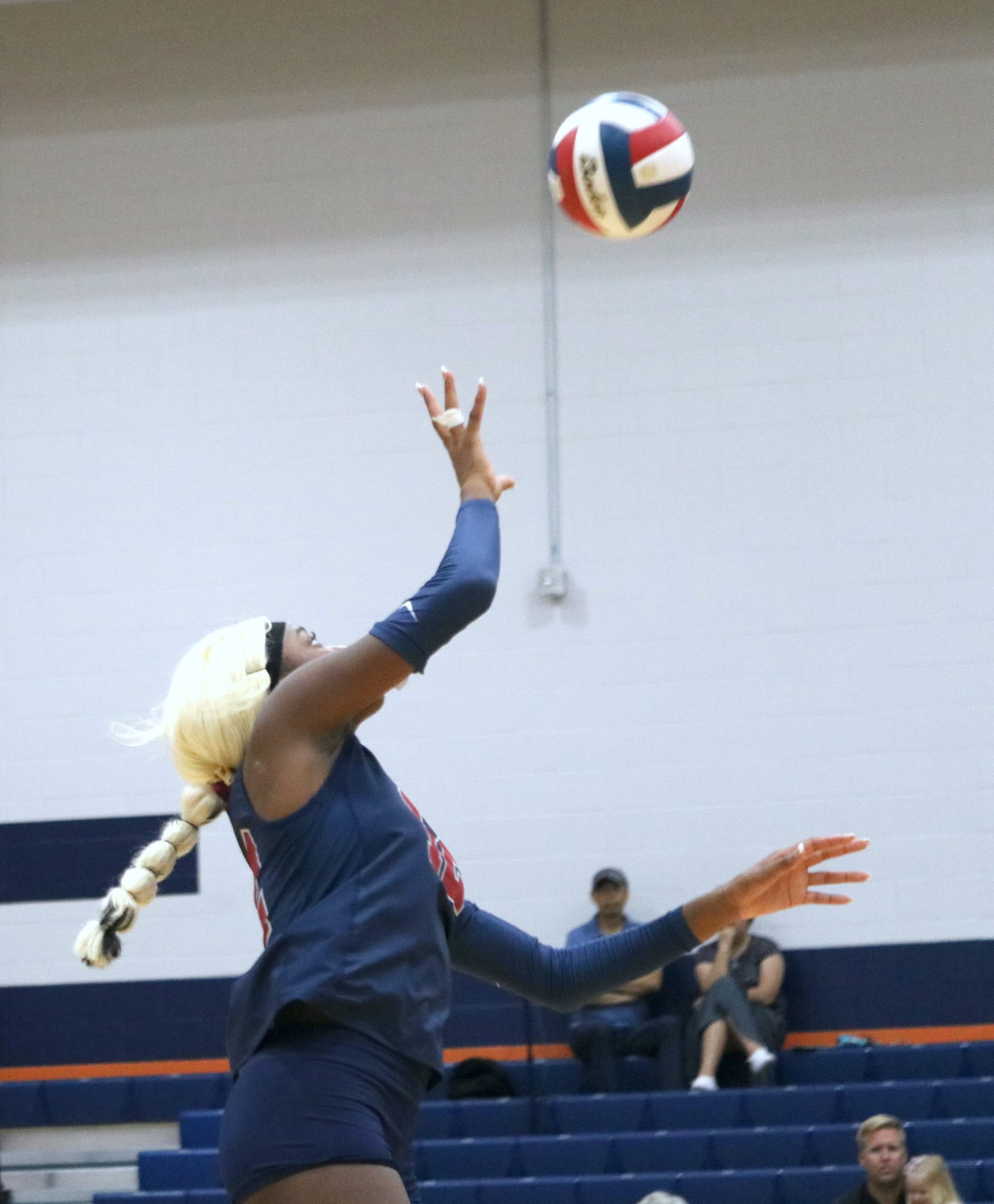 Tompkins’ Cindy Tchouangwa tips the ball over the net against Canyon in the finals match of gold bracket Katy ISD/Cy-Fair Tournament at Bridgeland.