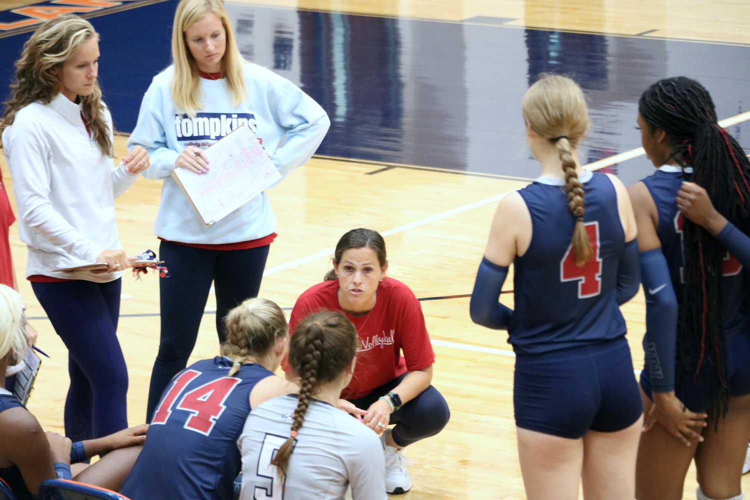Tompkins head coach Allison Merrell talks to her team during a timeout against Canyon in the finals match of gold bracket Katy ISD/Cy-Fair Tournament at Bridgeland.