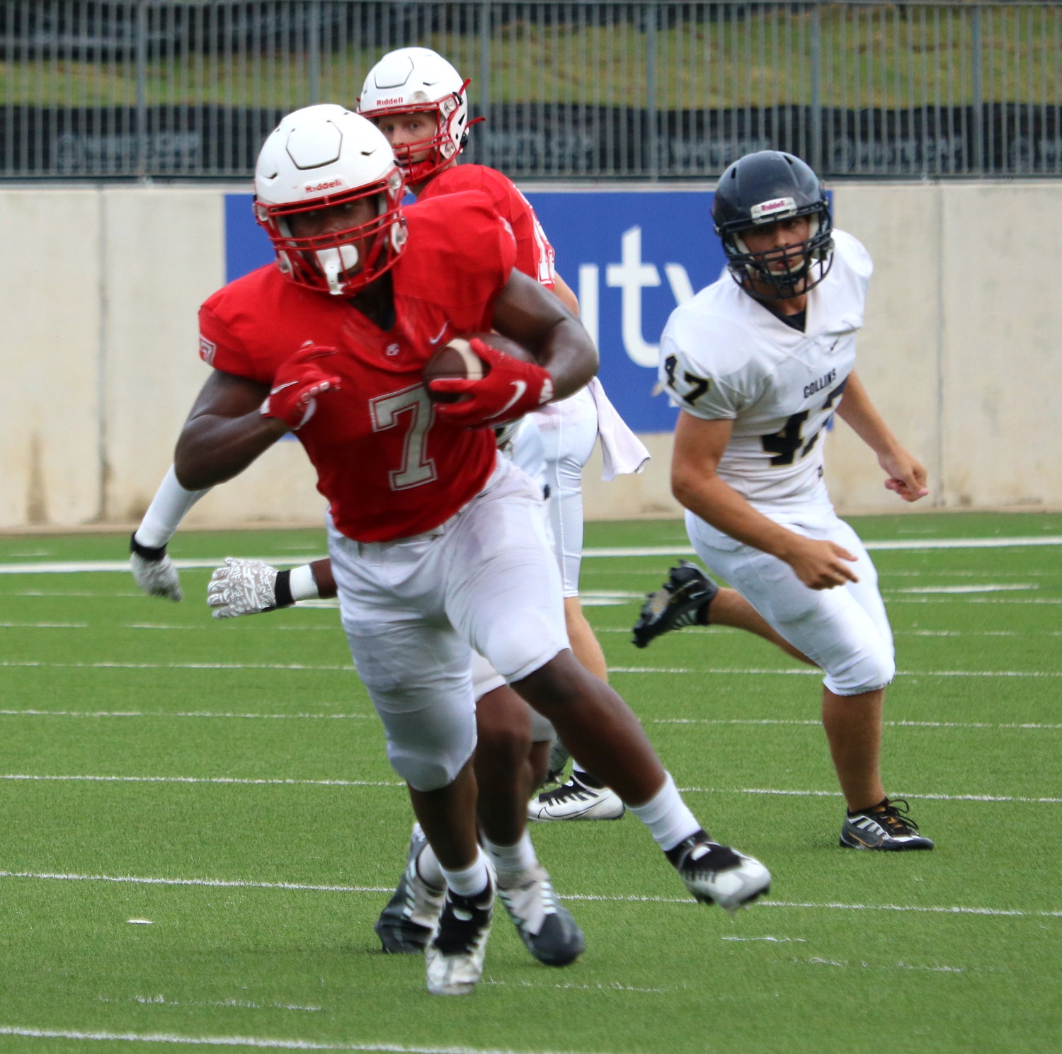 Katy’s Ramarian Tillman fights through contact during Katy’s scrimmage against Klein Collins on Friday at Legacy Stadium.