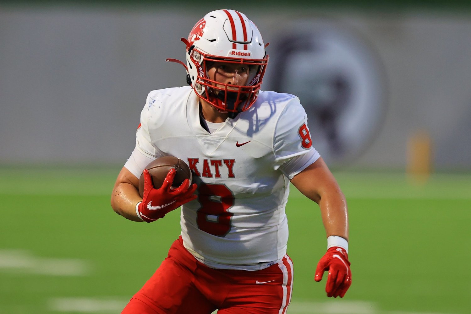Katy’s Chase Johnsey catches a pass during Saturday’s game between Katy and Tompkins at Legacy Stadium.