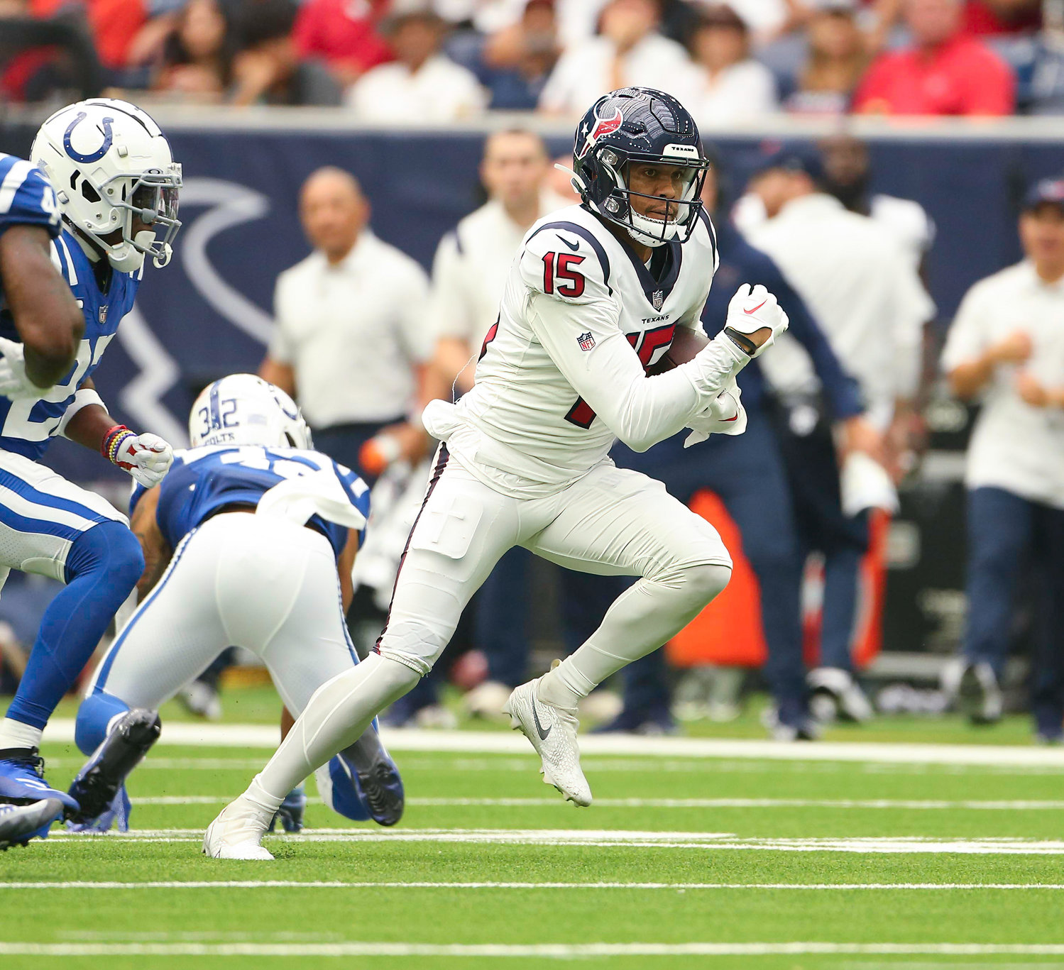 Houston Texans wide receiver Chris Moore (15) carries the ball after a catch during an NFL game between the Texans and the Colts on September 11, 2022 in Houston. The game ended in a 20-20 tie after a scoreless overtime period.