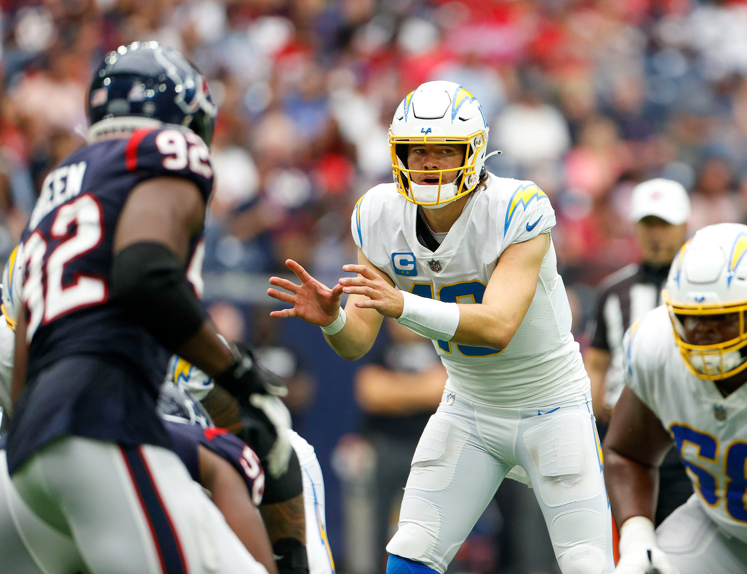 Chargers quarterback Justin Herbert (10) prepares for a snap during an NFL game between the Texans and the Chargers on Oct. 2, 2022 in Houston. The Chargers won 34-24.