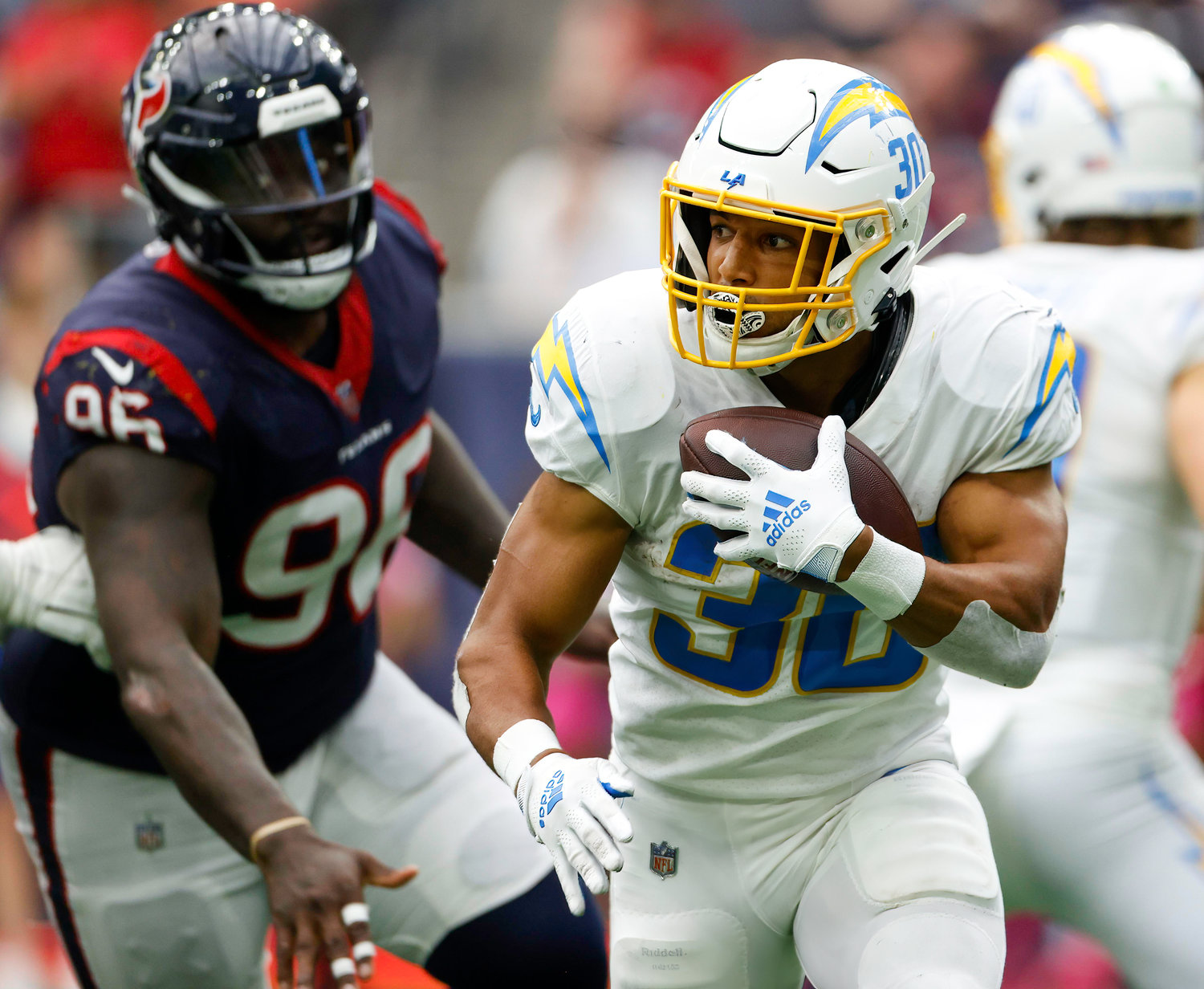 Chargers running back Austin Ekeler (30) carries the ball during an NFL game between the Texans and the Chargers on Oct. 2, 2022 in Houston. The Chargers won 34-24.