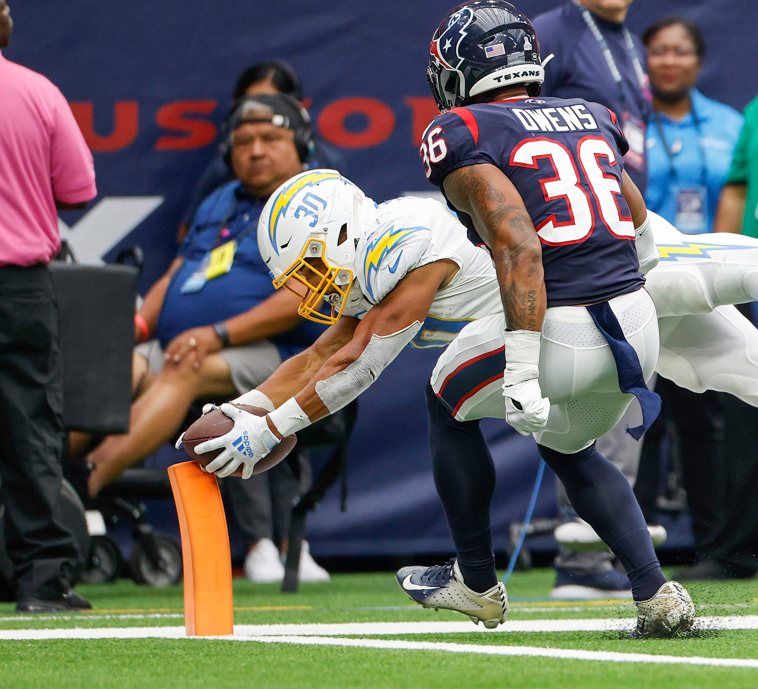 Chargers running back Austin Ekeler (30) dives to the pylon to score on a 14-yard touchdown reception during an NFL game between the Texans and the Chargers on Oct. 2, 2022 in Houston. The Chargers won 34-24.