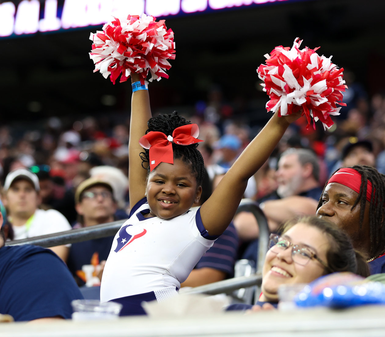 A Texans fan dresses up as a cheerleader during an NFL game between the Texans and the Titans on Oct. 30, 2022 in Houston.