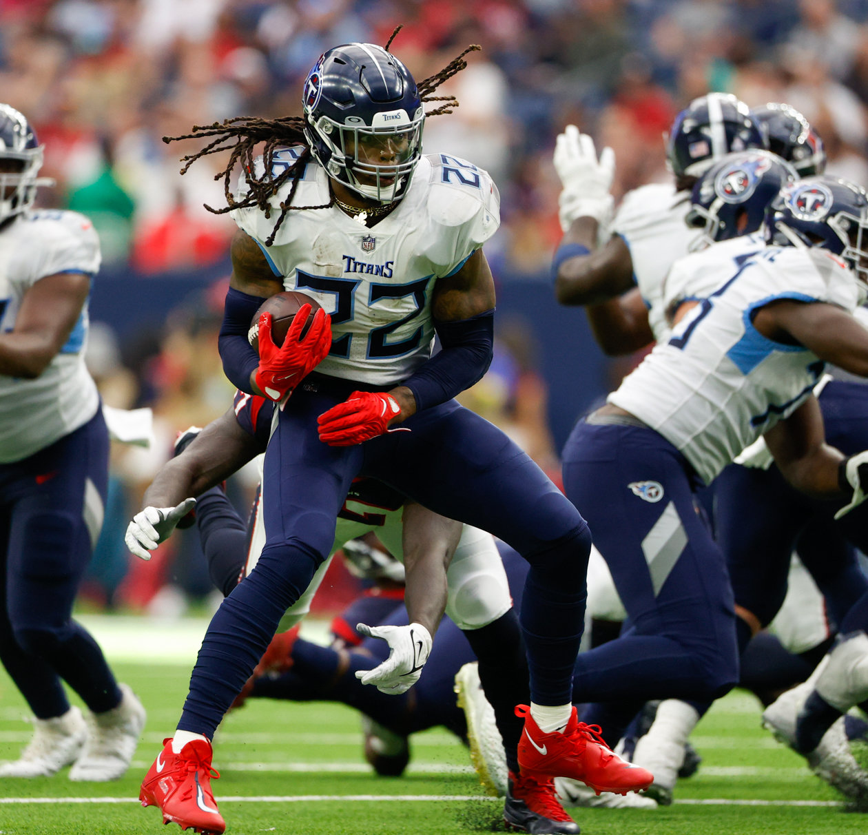 Titans running back Derrick Henry (22) carries the ball during an NFL game between the Texans and the Titans on Oct. 30, 2022 in Houston.