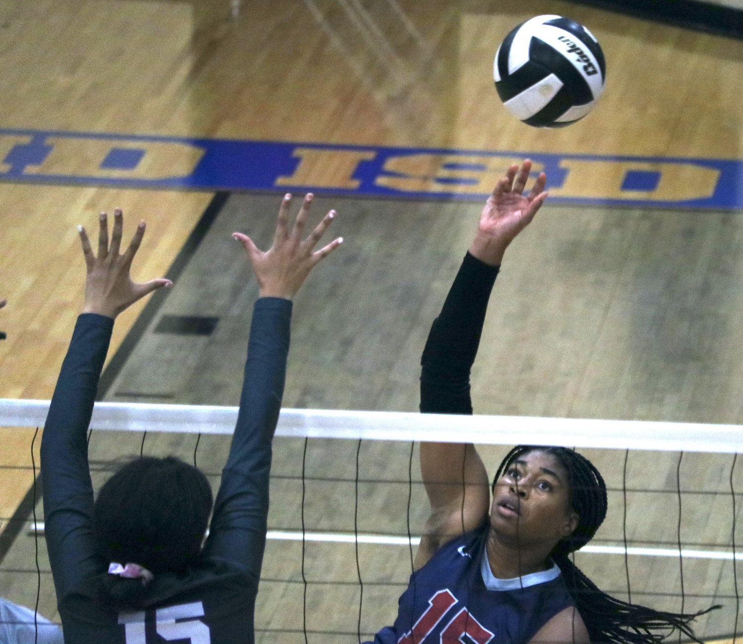 Tendai Titley makes a kill attempt during Tuesday's match between Tompkins and Ridge Point at Wheeler Field House.