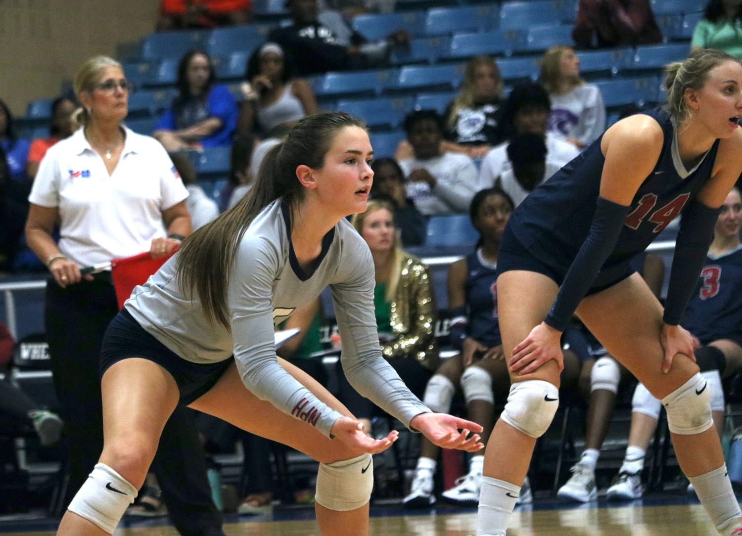 Brooklynn Merrell gets ready for an incoming serve during Tuesday's match between Tompkins and Ridge Point at Wheeler Field House.