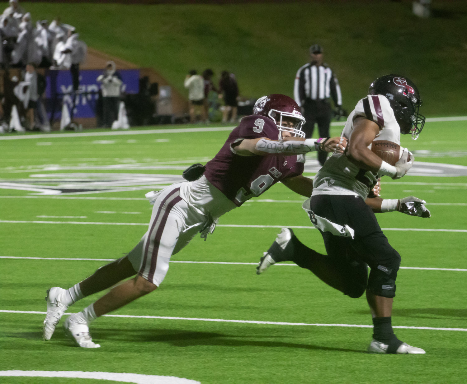 Yetxiel Perez-Gilbes makes a tackle during Friday's game between Cinco Ranch and George Ranch at Rhodes Stadium.