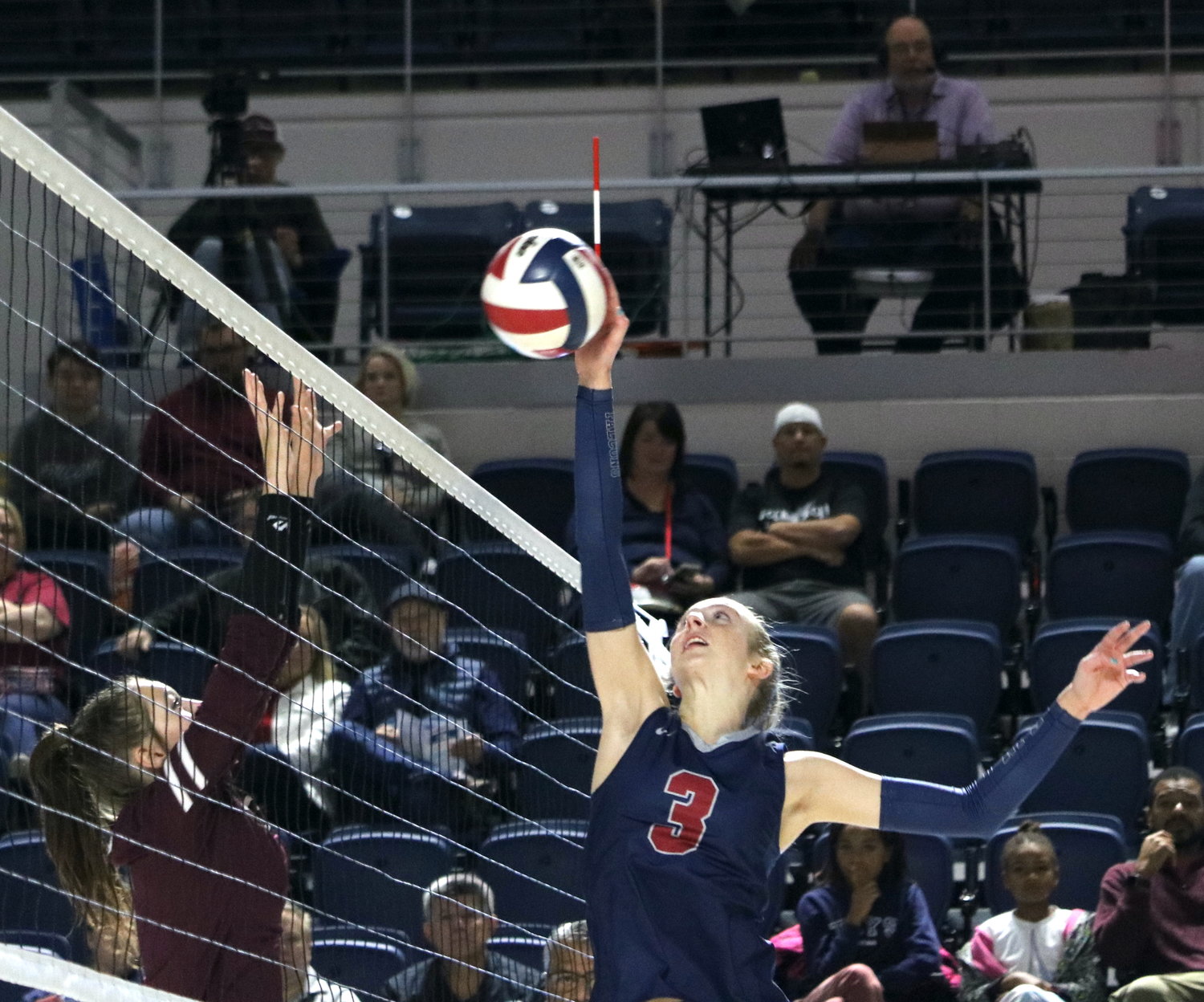 Presley Powell tips a ball over the net during Saturday’s Class 6A-Region III Final against Cinco Ranch at Delmar Fieldhouse.