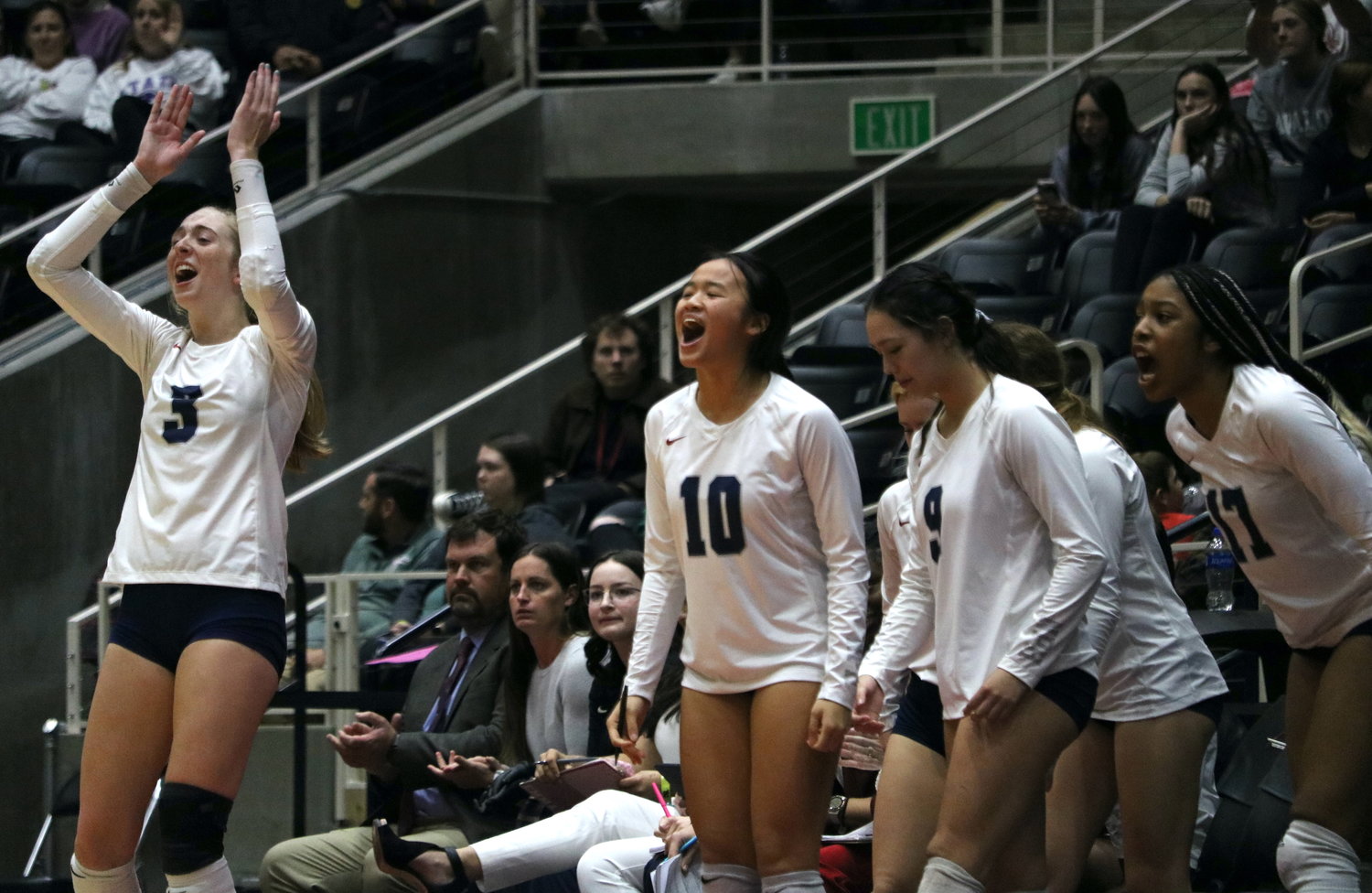 Presley Powell and teammates celebrate from the bench during Friday's Class 6A State Semifinal between Tompkins and Keller on Friday at the Curtis Culwell Center in Garland.