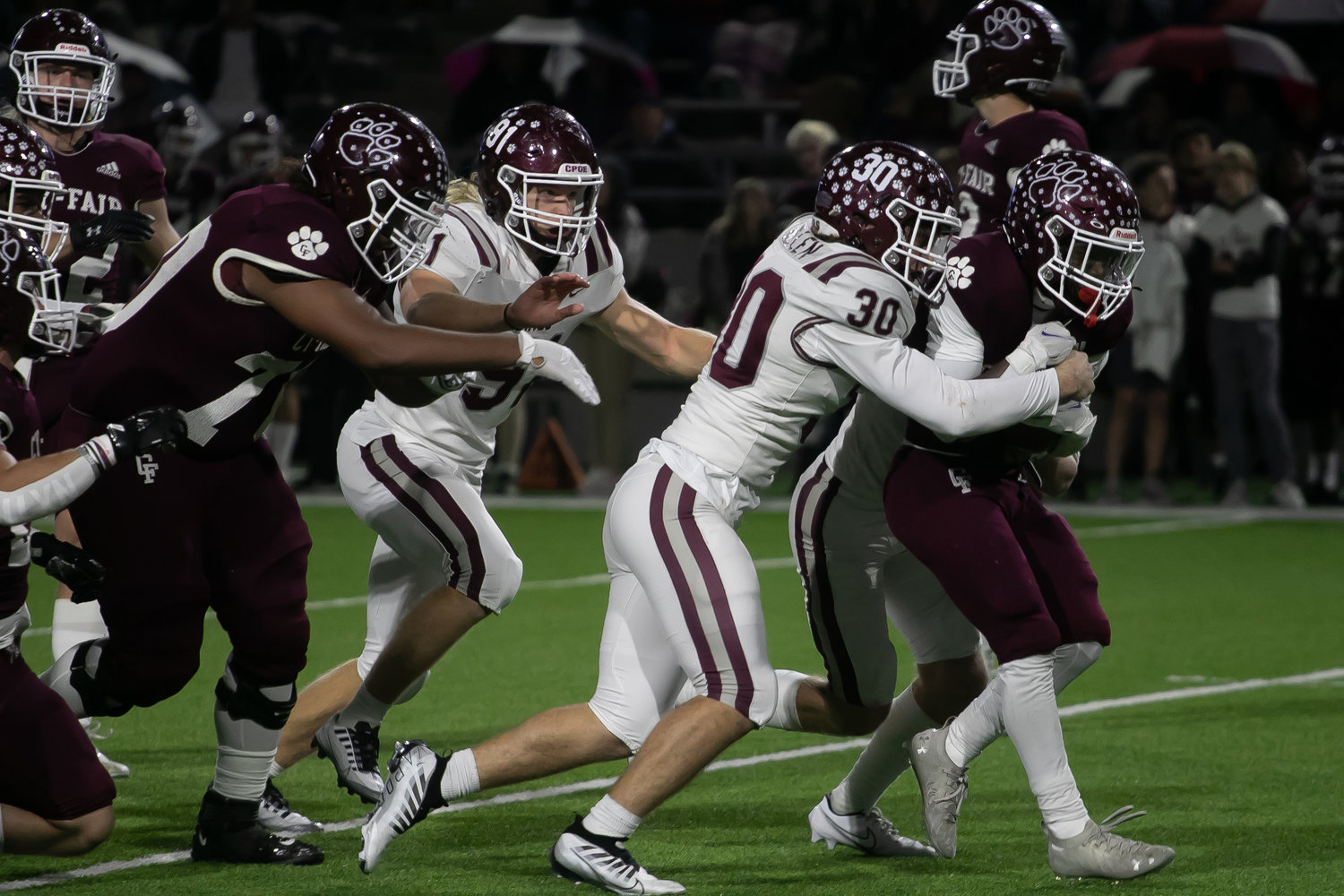 Cinco Ranch's  defense makes a stop on a ball carrier during Friday's Class 6A-Division I area round game between Cinco Ranch and Cy-Fair at Pridgeon Stadium.