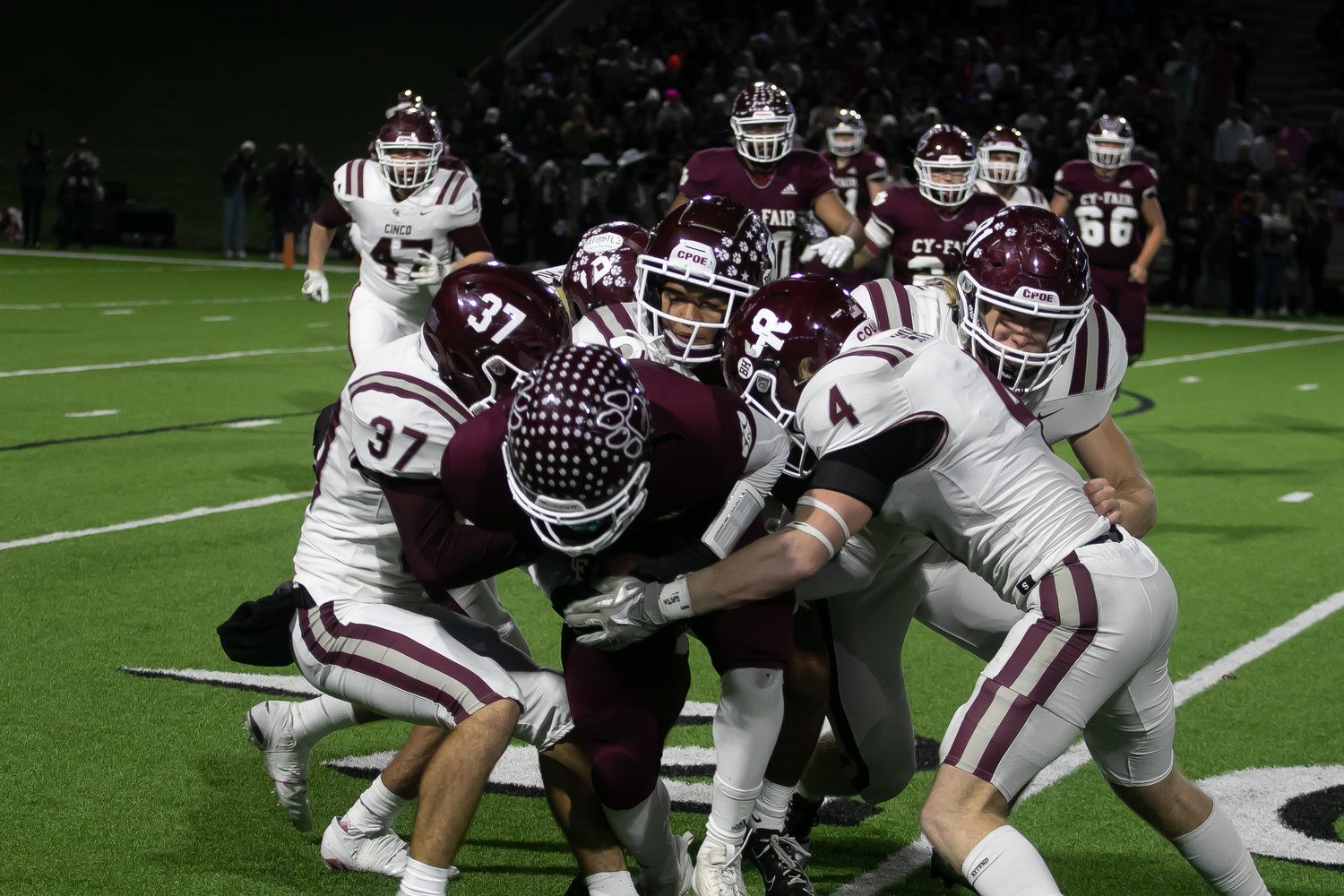 Cinco Ranch's defense makes a stop on a ballcarrier during Friday's Class 6A-Division I area round game between Cinco Ranch and Cy-Fair at Pridgeon Stadium.