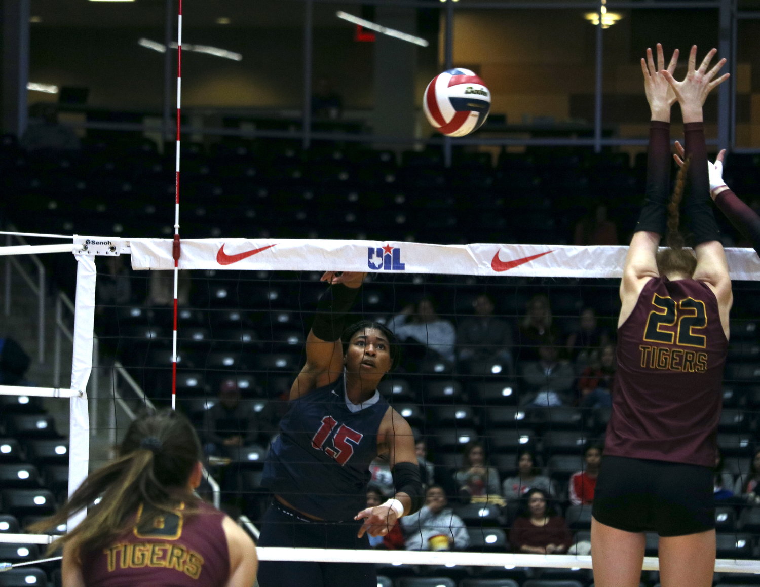 Tendai Titley spikes the ball during Saturday's state final between Tompkins and Dripping Springs at the Curtis Culwell Center in Garland.