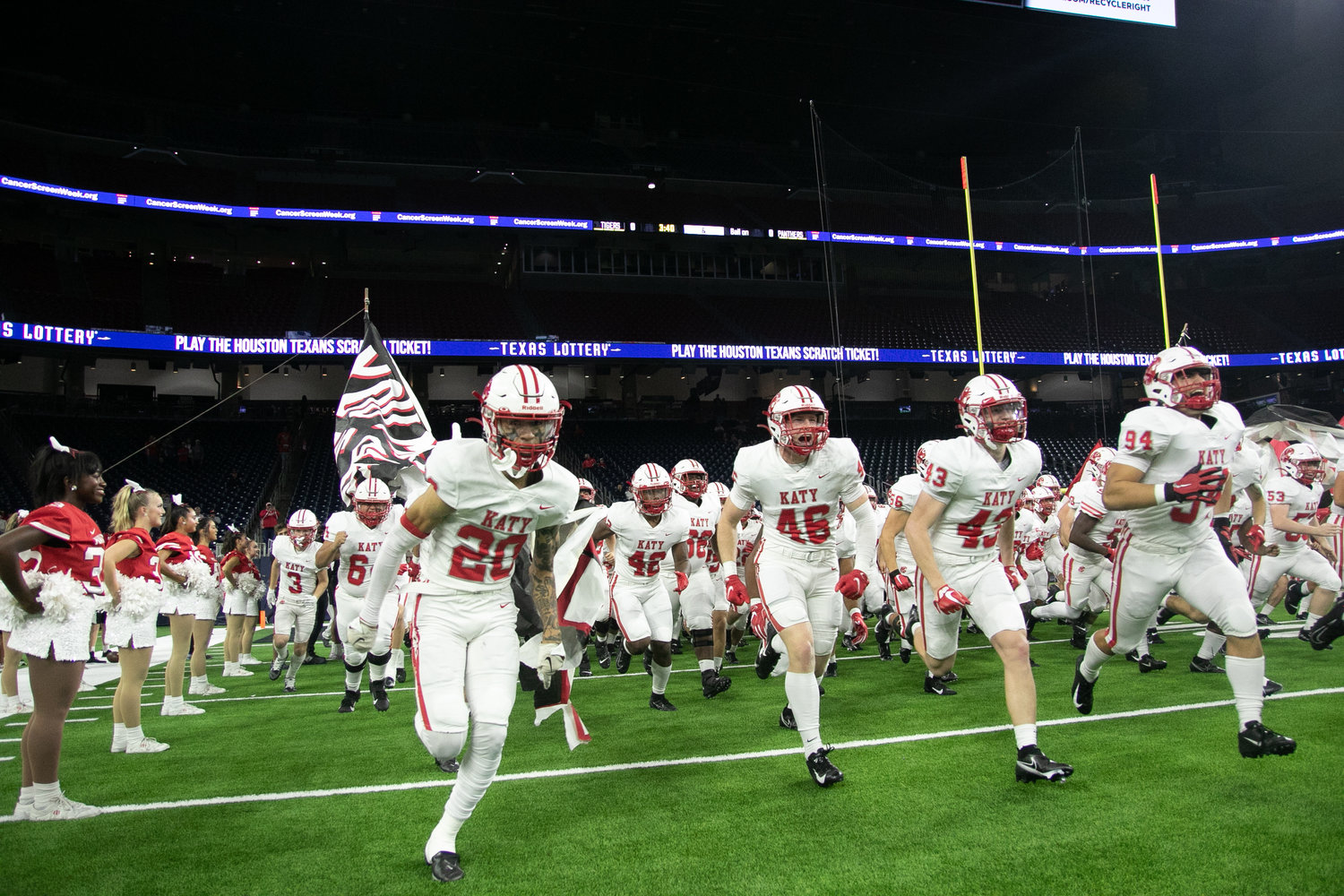 Katy players run on the field before Friday's Class 6A-Division II Region III Final between Katy and C.E. King at NRG Stadium.