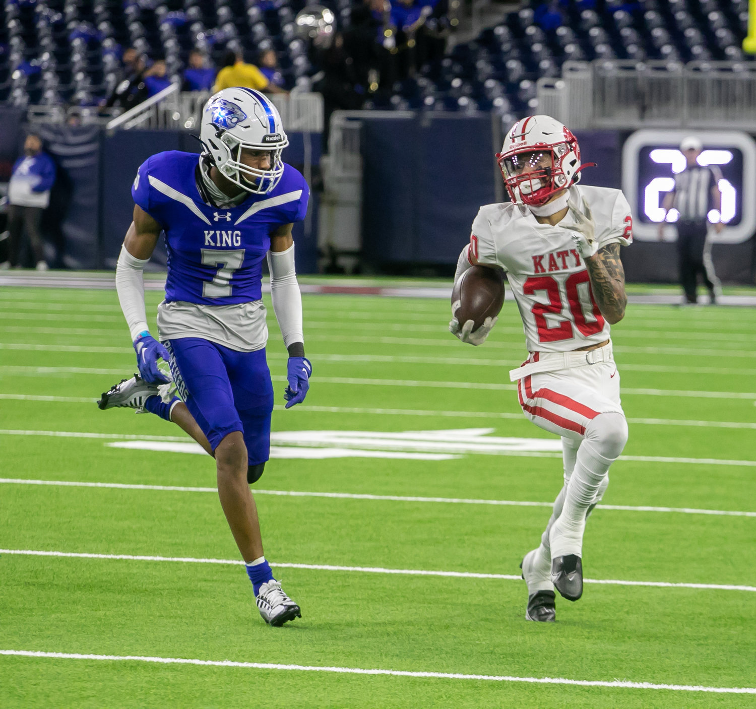 Micah Koenig tries to outrun a defender during Friday's Class 6A-Division II Region III Final between Katy and C.E. King at NRG Stadium.