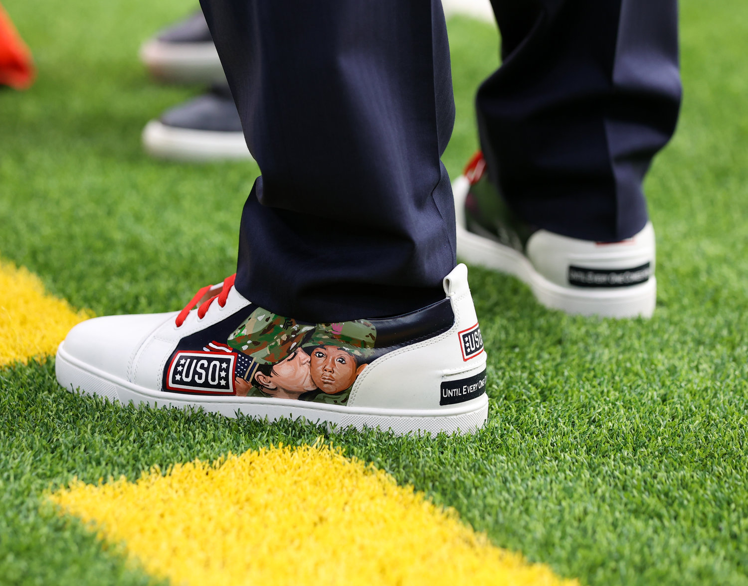 Houston Texans chairman and CEO Cal McNair wears a pair of custom shoes supporting the United Service Organizations (USO) for the NFL’s My Cause My Cleats day on Dec. 4, 2022, in Houston.