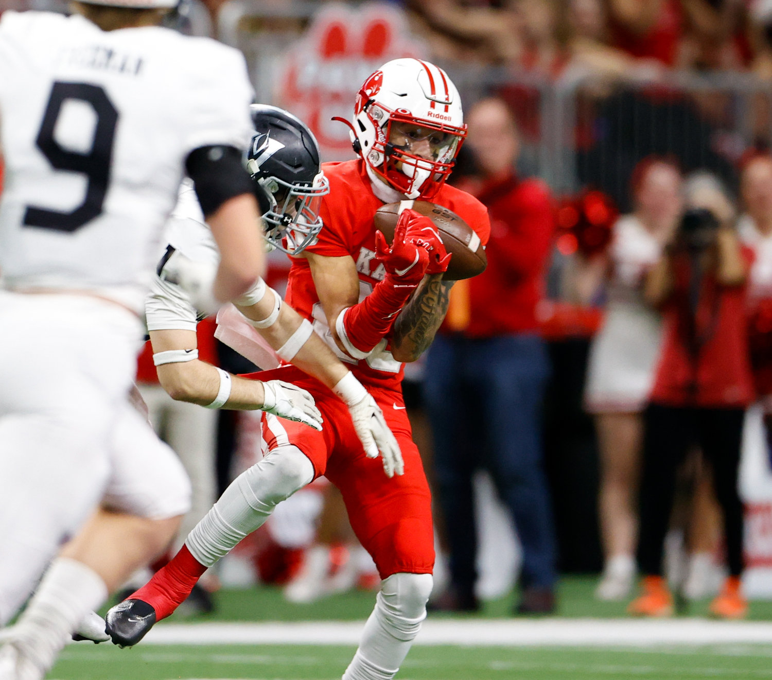 Katy wide receiver Micah Koenig (20) makes a catch behind the Vandegrift defense during the Class 6A-DII state semifinal football game between Katy and Vandegrift on Dec. 10, 2022 in San Antonio.