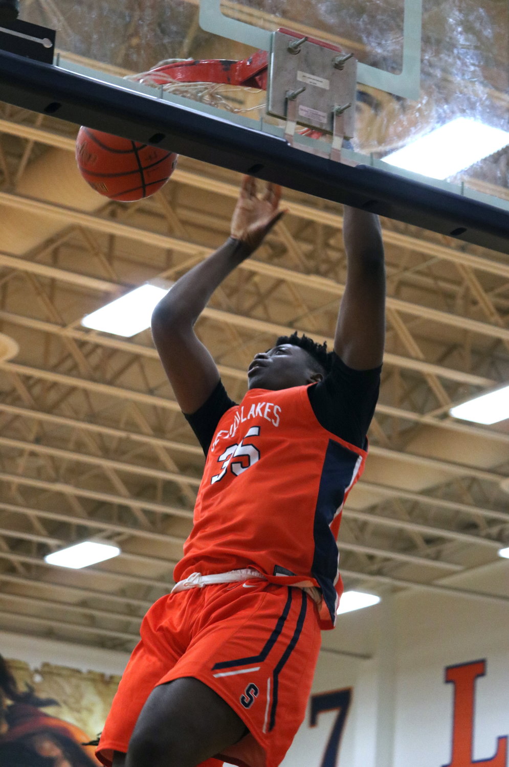 Josh Akpovwa dunks the ball during Monday’s game during Monday’s game between Seven Lakes and Mayde Creek at the Seven Lakes gym.