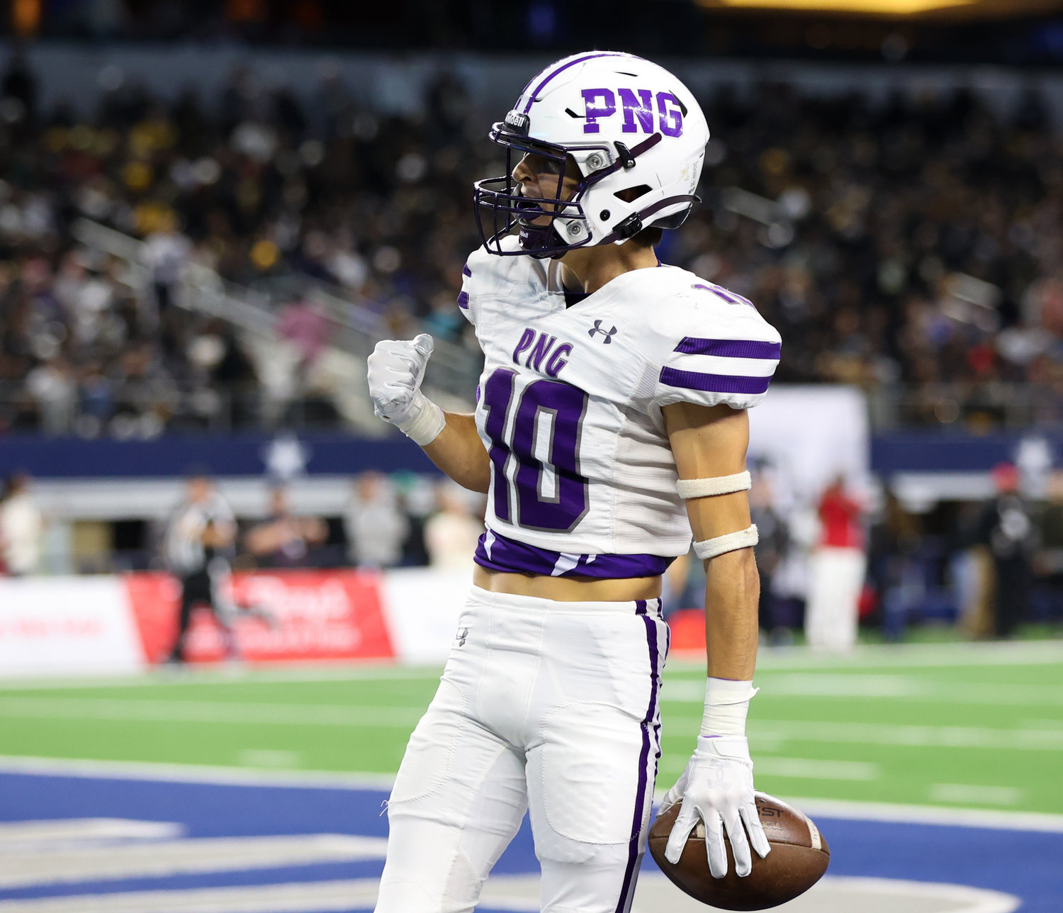 Port Neches-Groves defensive back Landon Guarnere (10) gestures in celebration after a touchdown during the Class 5A Division II football state championship game between South Oak Cliff and Port Neches-Groves in Arlington, Texas, on Dec. 16, 2022.
