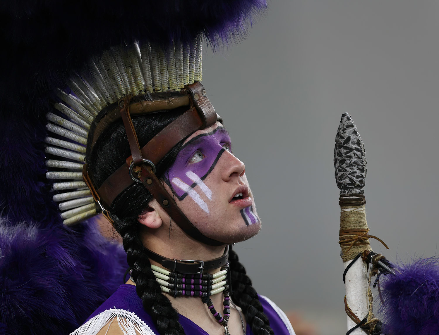 The Port Neches-Groves Indians mascot looks up at the video board during the Class 5A Division II football state championship game between South Oak Cliff and Port Neches-Groves in Arlington, Texas, on Dec. 16, 2022.
