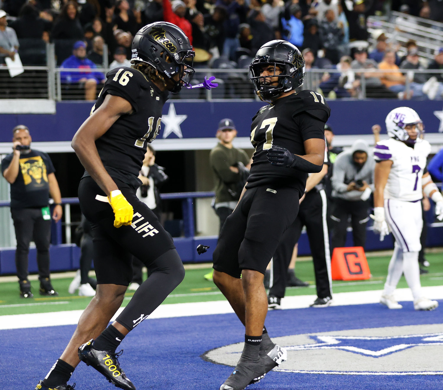 South Oak Cliff wide receiver Trey Jackson (16) and wide receiver Rickey Evans (17) celebrate after a touchdown during the Class 5A Division II football state championship game between South Oak Cliff and Port Neches-Groves in Arlington, Texas, on Dec. 16, 2022.