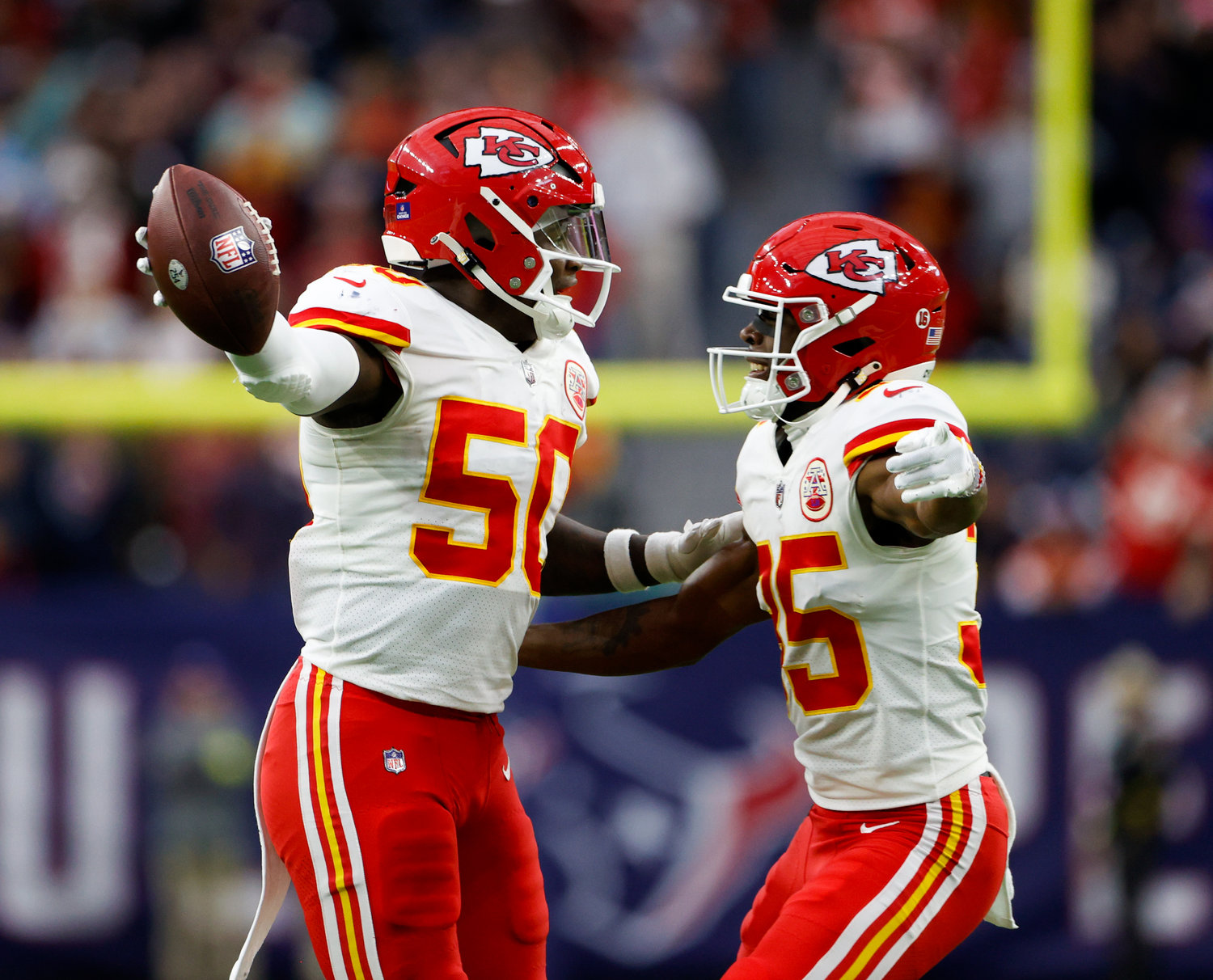 Kansas City Chiefs linebacker Willie Gay (50) celebrates with cornerback Jaylen Watson (35) after recovering a fumble to set up a game-winning score in overtime during an NFL game between the Texans and the Chiefs on Dec. 18, 2022, in Houston. The Chiefs won, 30-24 in overtime.