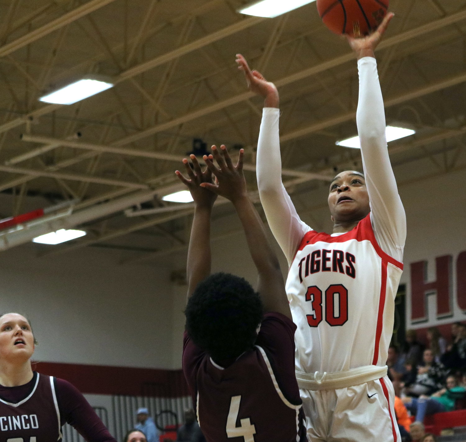 Lyric Barr shoots a layup over a Cinco Ranch defender during Tuesday’s game between Katy and Cinco Ranch at the Katy gym.