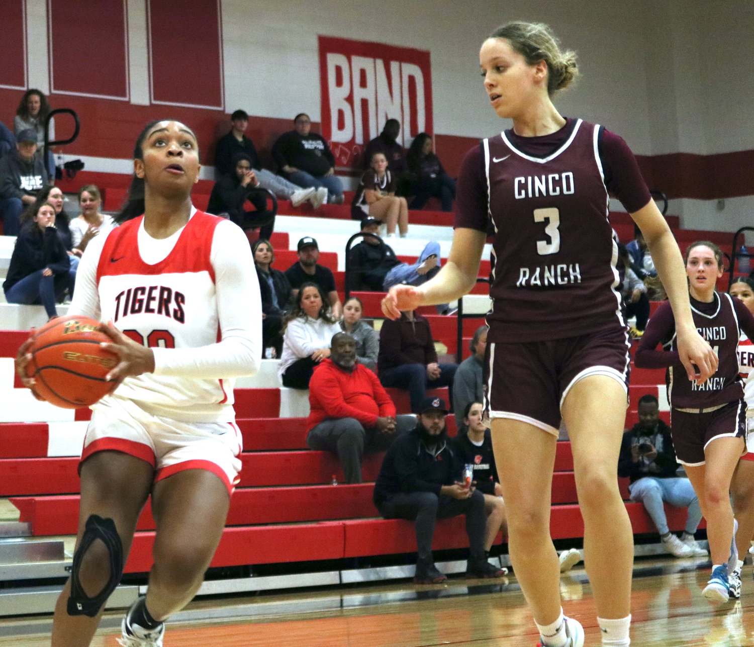 Lyric Barr drives past a defender during Tuesday’s game between Katy and Cinco Ranch at the Katy gym.